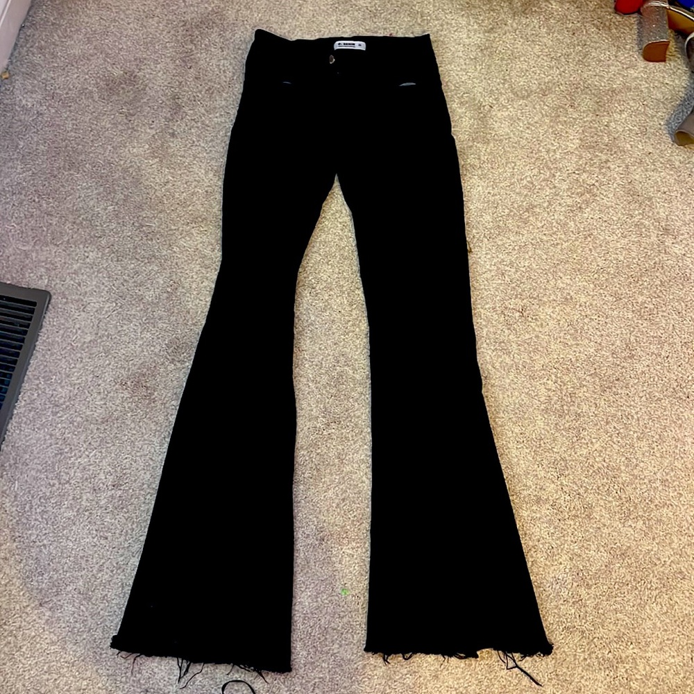 O2 Denim black flare jeans with rips in the knees
